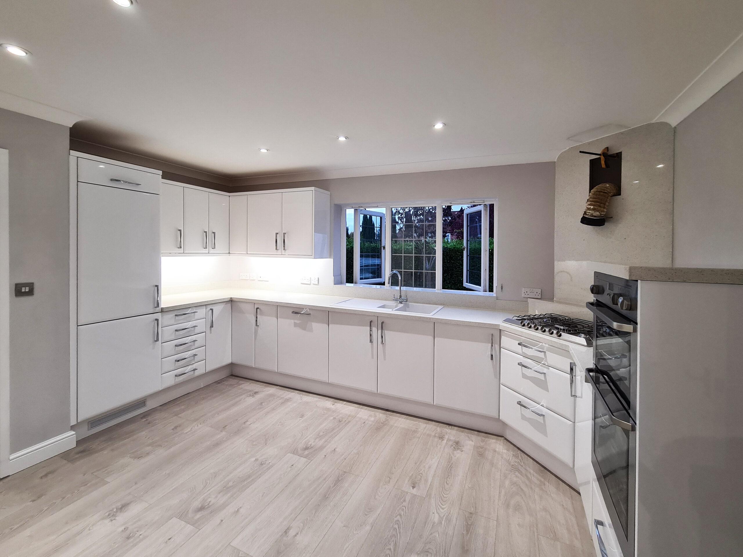 Spacious kitchen renovation with modern lighting and open layout